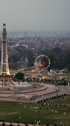 an aerial view of a ferris wheel and amusement park