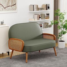 a green chair sitting in front of a book shelf