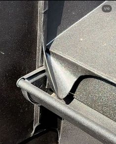 a close up view of the corner of a metal object