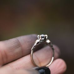 I hand carved a tiny bird skull in jewellers wax, and cast and molded it. I then used the mold to create a duplicate of the skull, and built this ring in wax. The wax model was cast using the lost wax casting method, where the wax is burned away, and the end result is solid 14k gold. The skulls are 4.5x11mm. This ring will be custom made for you, in your ring size. You can choose between yellow, rose or palladium white gold. The pictured ring is 14k yellow gold, with black rhodium that has been Antique Sterling Silver Jewelry For Promises, Antique Sterling Silver Promise Jewelry, Heirloom Sterling Silver Hand Cast Jewelry, Silver Brass Promise Jewelry, Silver Brass Jewelry For Promise, Heirloom Hand Cast Sterling Silver Jewelry, Hand Cast 14k Gold Wedding Jewelry, White Gold Skull Jewelry For Promise Ring, Heirloom 14k Gold Hand-cast Jewelry