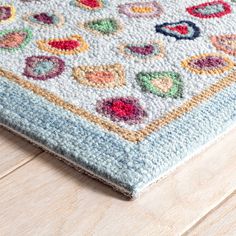 a multicolored area rug on the floor