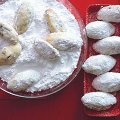 powdered sugar and cookies on a red table