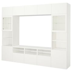 a white entertainment center with built in shelving units