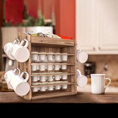 a wooden shelf with cups and mugs on it