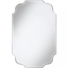 a large mirror with an ornate frame on the front and back side, in white