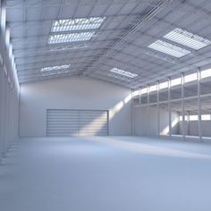 an empty warehouse with lots of windows on the ceiling and no one in it yet