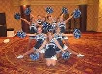 a group of cheerleaders posing for a photo