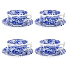 four blue and white tea cups and saucers