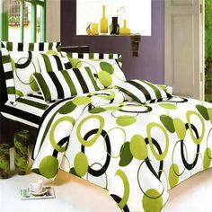 a bed with green and black designs on it