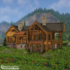 a large wooden house sitting on top of a lush green hillside