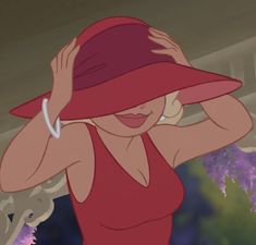 a woman in a red dress and hat with her hands on her head while standing next to a tree