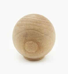 a wooden ball on a white background