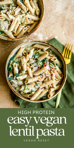 two bowls filled with pasta on top of a table