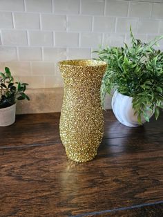 "This listing is for five 8.5\" tall gold glitter vases.  This vase is perfect for party decor, wedding decor, home decor, and centerpieces!  Each vase is handpainted with glitter and sealed twice to prevent the glitter from flaking off.  This vase is 8.5\" tall with a 3.75\" wide opening. Flowers are not included. **If you are looking to purchase more than one item and the shipping seems to be too much, please reach out to me so that we can figure out if I am able to reduce the number of boxes Gold Vase Centerpieces, Glitter Vases, Dinner Home, 50th Wedding Anniversary Party, Gold Vase, Anniversary Dinner, Gold Vases, Wedding Anniversary Party, 50th Wedding Anniversary