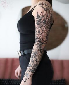 a woman with a tattoo on her arm