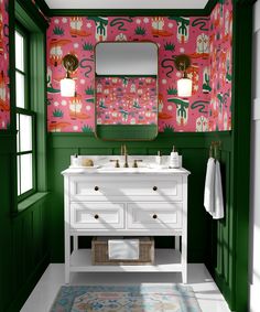 a bathroom with pink and green wallpaper, white sink and vanity in front of mirror