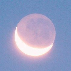 the moon is seen in the sky with no clouds on it's side,