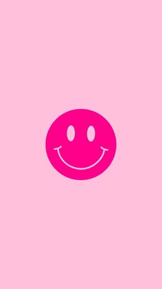 a pink smiley face on a pink background