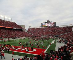 a football stadium filled with fans and players