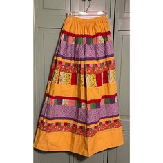 Brand: Mountain Artisans Condition: Excellent Vintage Used Condition 70’s Tiered Patchwork Maxi Skirt Golden Yellow Base With Pinks, Purples, Green, Red And Floral Patches Side Zipper With Top Closure, Lined Size: Vtg Size 8 Measurements From Laying Flat: Waist 12” Hips: 27” - Fabric Stretched Out Length 40” #Woodstock #Prarie #Boho #Freespirit #Quilt #Goldenrod Patchwork Maxi Skirt, Maxi Skirt Vintage, Floral Patches, Skirt Vintage, Women Skirts Midi, Golden Yellow, Woodstock, Vintage Skirt, Side Zipper