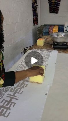 a woman is making cheese on a table