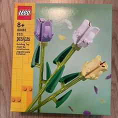 a lego box with two flowers in it