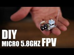 a hand holding a miniature camera in it's palm with the words diy micro 5 6ghz fpv