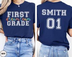 two women wearing shirts that say first, dream, and grade on the back of their shirts