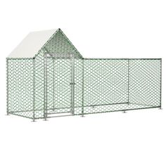 a green chicken coop with a white roof and two doors on the side, in front of a white background