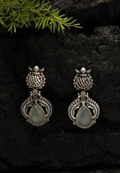 Grey Stone Studded Oxidised Earrings  Brass Based Oxidised Earrings in Silver and Grey, Adorned with Stone, Take the centre stage with this Traditional Ethnic Jewellery, handmade with intricate Indian craftsmanship and exclusively choosen from a curated collection of exquiste pieces, brought to you by Fabula. The earrings can be teamed up with festive wear and also with casual wear for a complete look.  About The Product: Grey Stone Studded Oxidised Earrings Approximate Length is 5.5 cm, Designe Festive Oxidized Finish Earrings For Ceremonial Occasions, Ceremonial Oxidized Finish Earrings For Festive Occasions, Ceremonial Festive Earrings With Oxidized Finish, Festive Ceremonial Earrings With Oxidized Finish, Festive Ceremonial Oxidized Finish Earrings, Ornate Oxidized Earrings For Festive Occasions, Ornate Oxidized Finish Festive Earrings, Ceremonial Silver Bridal Earrings With Intricate Design, Silver Bridal Earrings With Intricate Design For Ceremonial Occasions