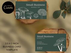 two small business cards sitting on top of wooden slices