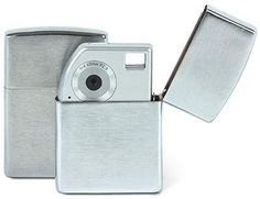 a silver colored lighter with a camera attached to the top and bottom cover, on a white background