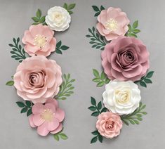 paper flowers are arranged on a gray surface