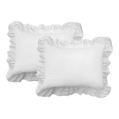 a white pillow with scalloped edges on a white background, it looks like something out of the victorian era