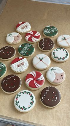 many decorated cookies sitting on top of a counter