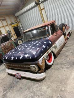 an old truck painted like the american flag with red, white and blue stars on it