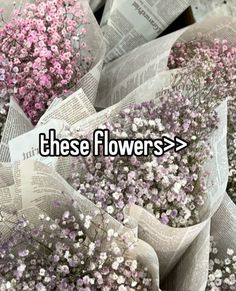 there are many newspaper flowers in the bouquets with pink and white flowers on them