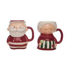 two ceramic mugs with santa and mrs claus on them