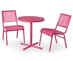 two pink chairs and a table with one chair on the other side, all in different colors