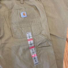 The Women's Original Fit Crawford Pant By Carhartt. Size 12 Tall. Measurements Approx: 14.5" Rise 17" Across Waist 33.5" Inseam Color Is Tan Carhartt Jeans Women, Womens Carhartt, Carhartt Carpenter Jeans, Carhartt Cargo Pants, Carhartt Scrubs, Carhartt Jeans, Carhartt Womens, Carhartt Pants, Vintage Carhartt