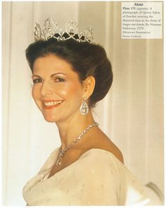 a woman wearing a tiara and smiling at the camera