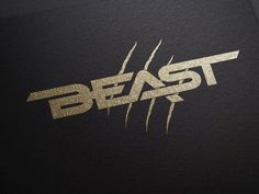 the beast logo is shown in gold on black paper