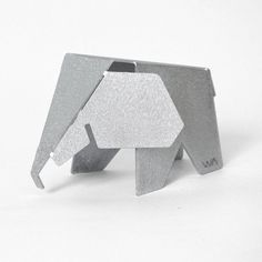 an elephant made out of metal on a white background