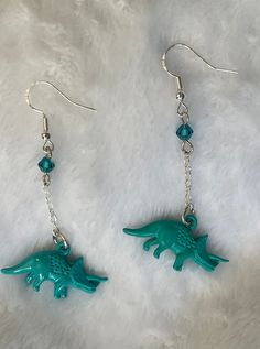 Hand made dinosaur / triceratops earrings. Dinosaur Triceratops, Dinosaur Earrings, Jewelry Earrings Dangle, Etsy Earrings, Dangle Drop Earrings, Hand Made, Dangle Earrings, Jewelry Earrings, Ships