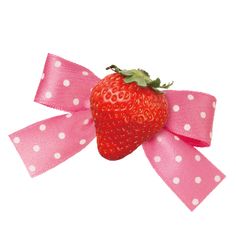 a strawberry with pink and white polka dots tied to it's side on a pink ribbon