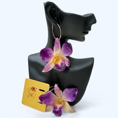 These exquisite Real Orchid rund hoop earrings are handmade with love, using real purple orchids and high-quality resin. The earrings are crafted with 18k gold-plated copper alloy round hoop. Measuring 2-3 inches in length and 2.5-3 inches in width, each orchid carries a unique touch as they are made from real orchid flowers. Experience timeless elegance with these captivating earrings. Perfect for adding a touch of nature to any outfit. The colors and shape of each orchid might be slightly different as they are made of real orchid flowers. These flowers have a protective resin coating that makes them durable and suitable for daily use. However, please handle them with care to prevent damage. Avoid bending, dropping, or applying excessive pressure on them. Unique Orchid Colored Jewelry For Gift, Orchid Accessories, Handmade Orchid Earrings, Resin Orchid Earrings, Elegant Orchid Flower Earrings, Purple Orchids, Resin Coating, Orchid Flower, Jewelry Earrings Hoops