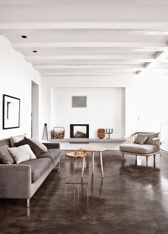 a living room filled with furniture and a fire place