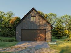 a large garage sits in the middle of a grassy area with trees and grass around it