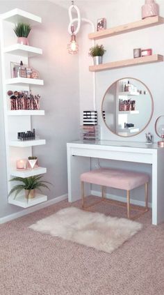 a white desk with shelves and a mirror on it in front of a pink rug