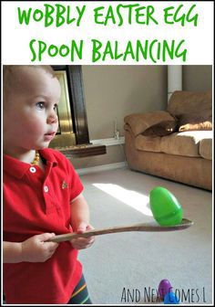 a young boy holding a wooden spoon in front of his face and the words wobbly easter egg spoon balancing on it